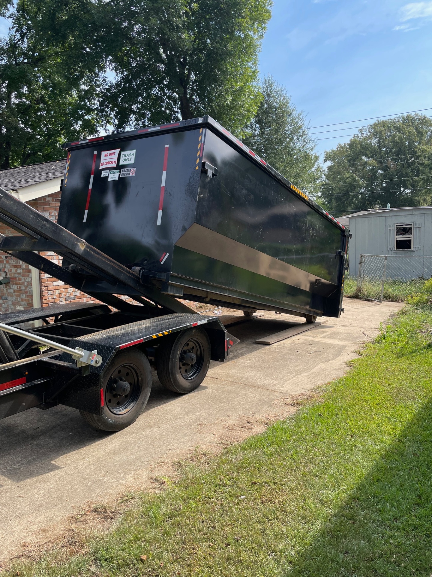 25 yard dumpster placed in a driveway