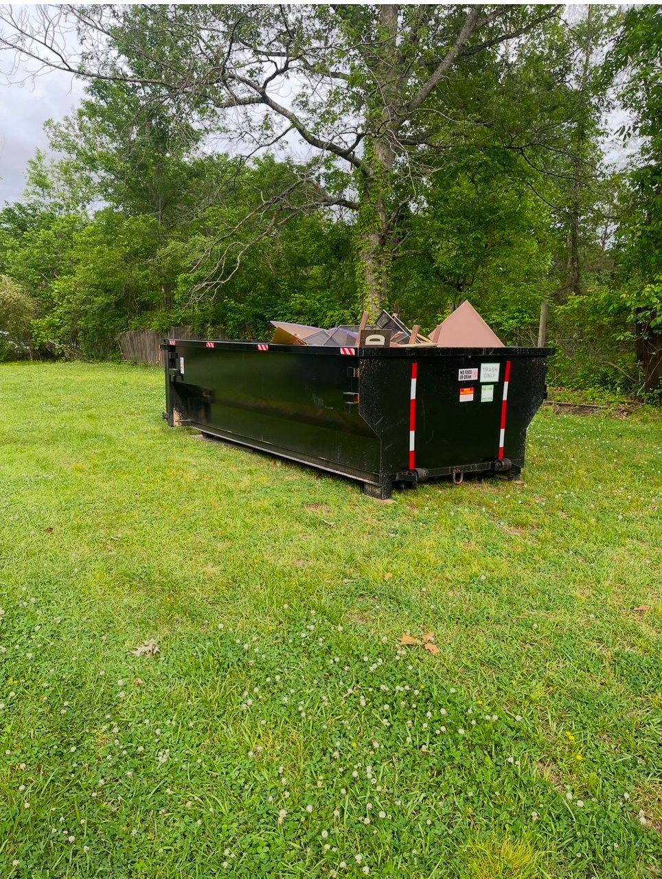 15 yard dumpster in a driveway