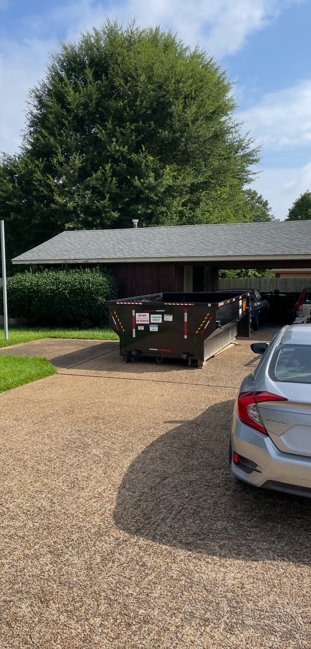 Dumpster placed under carport